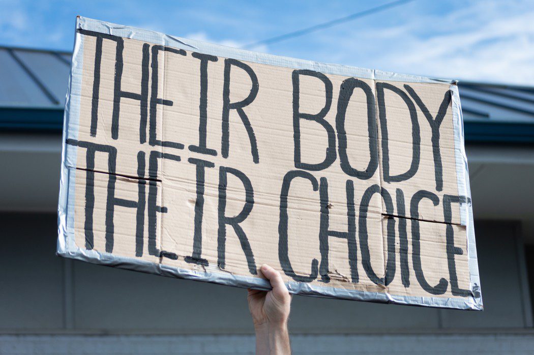 a-hand-holding-a-sign-supporting-pro-choice-during-a-planned-parenthood-rally-for-abortion-justice